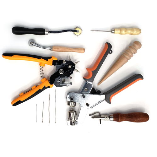 Various hand tools for working with leather including punches, overstitch wheels, groover, burnishers, and needles
